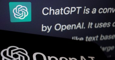 The logo of OpenAI is displayed near a response by its AI chatbot ChatGPT on its website, in this illustration picture taken Feb. 9, 2023. (Reuters Photo)