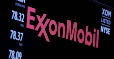The logo of Exxon Mobil Corporation is shown on a monitor above the floor of the New York Stock Exchange in New York, U.S., Dec. 30, 2015. (Reuters Photo)