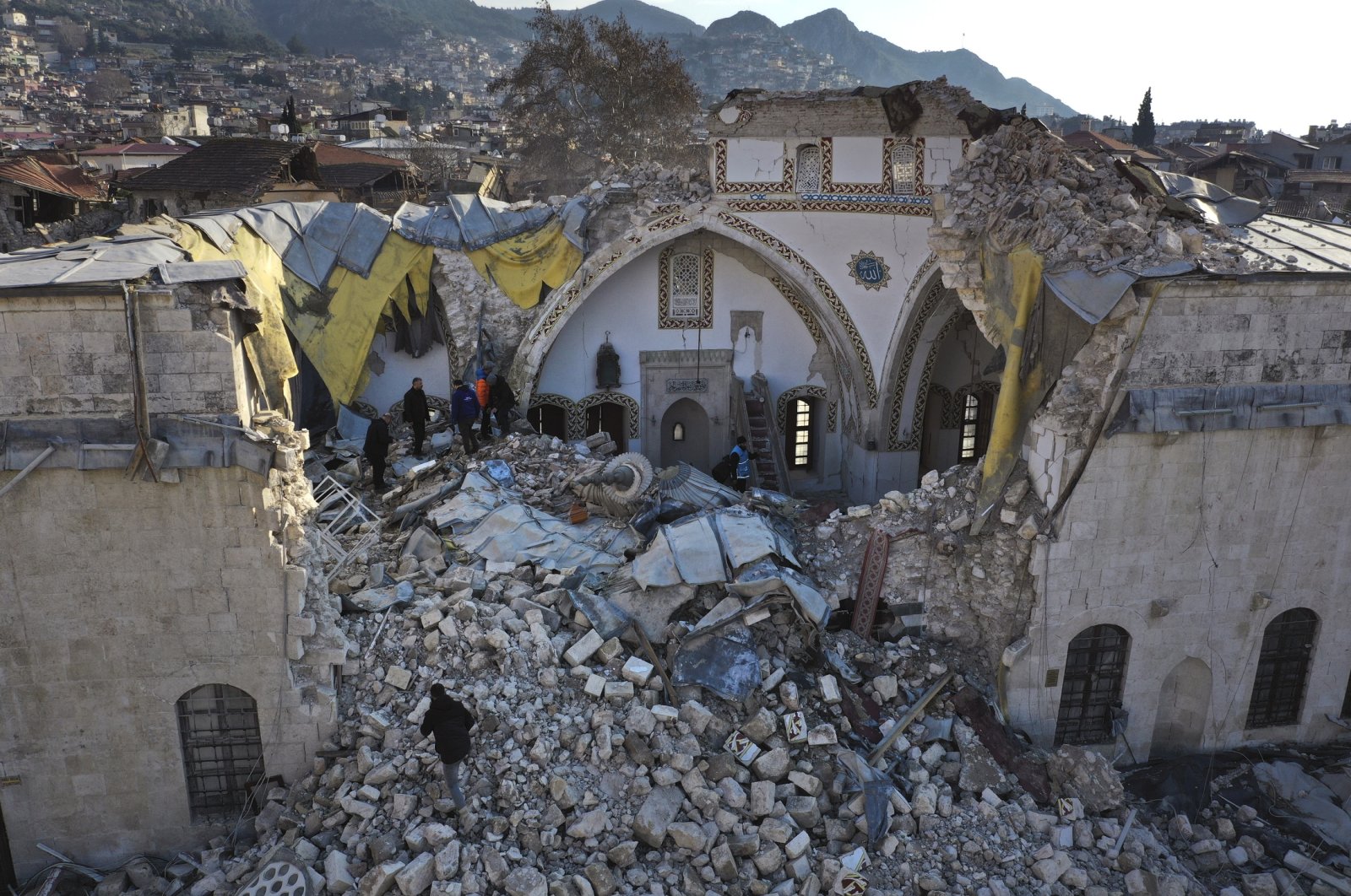 Turkish citizens check the historic Habib Najjar mosque which destroyed during the devastated earthquake, in the old city of Antakya, Türkiye, Feb. 11, 2023. (AP Photo)