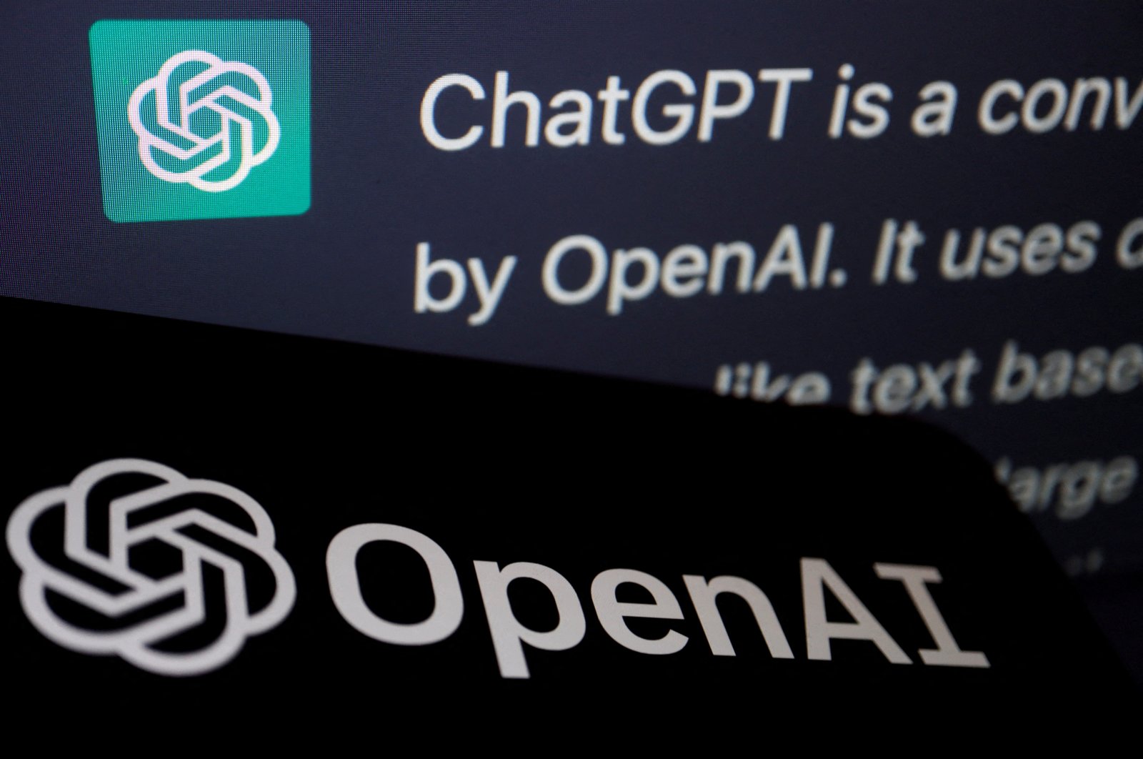 The logo of OpenAI is displayed near a response by its AI chatbot ChatGPT on its website, in this illustration picture taken Feb. 9, 2023. (Reuters Photo)