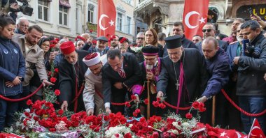 People leave flowers in memory of victims at the site of the Istiklal Street attack, in Istanbul, Türkiye, Nov. 16, 2022. (AA Photo)