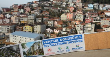 A sign of an urban transformation project against the backdrop of buildings in Beykoz, Istanbul, Feb. 24, 2023. (Photo by Mustafa Bakırhan)