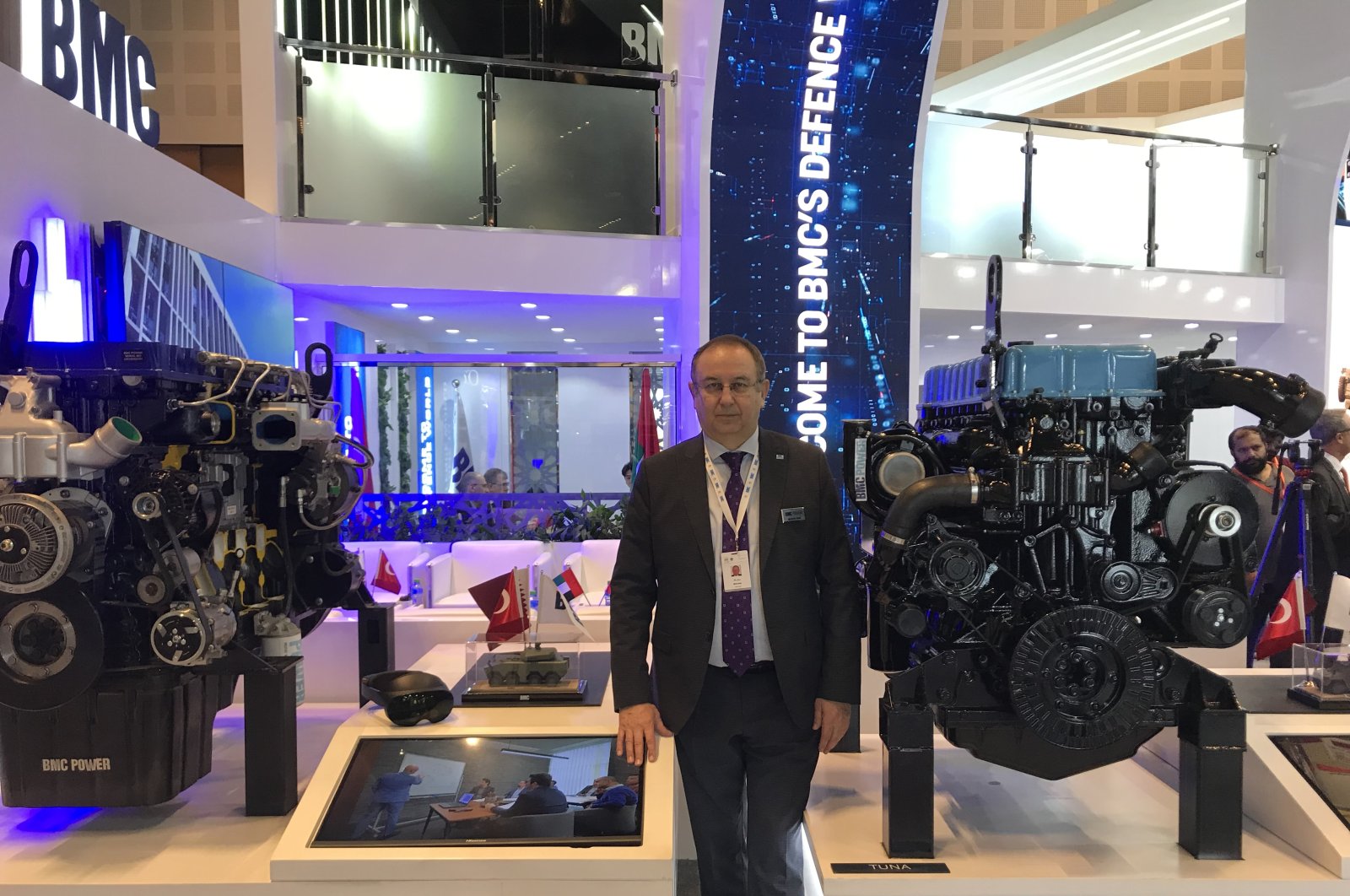 Mustafa Kaval, the general manager of BMC Power, poses in front of the company&#039;s engines on display at the IDEX fair in Abu Dhabi, UAE, Feb. 24, 2023. (AA Photo)
