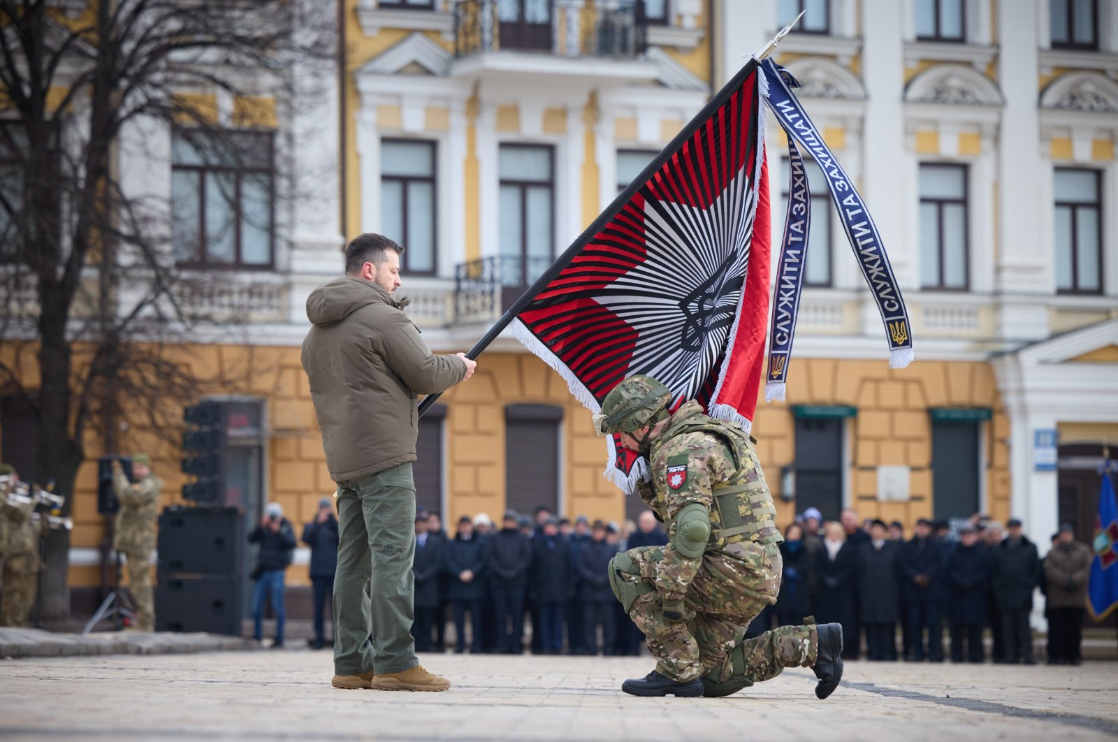 President Volodymyr Zelenskyy bestows a flag to a soldier at a ceremony in Kyiv, Ukraine, Feb. 24, 2022. (AA Photo)