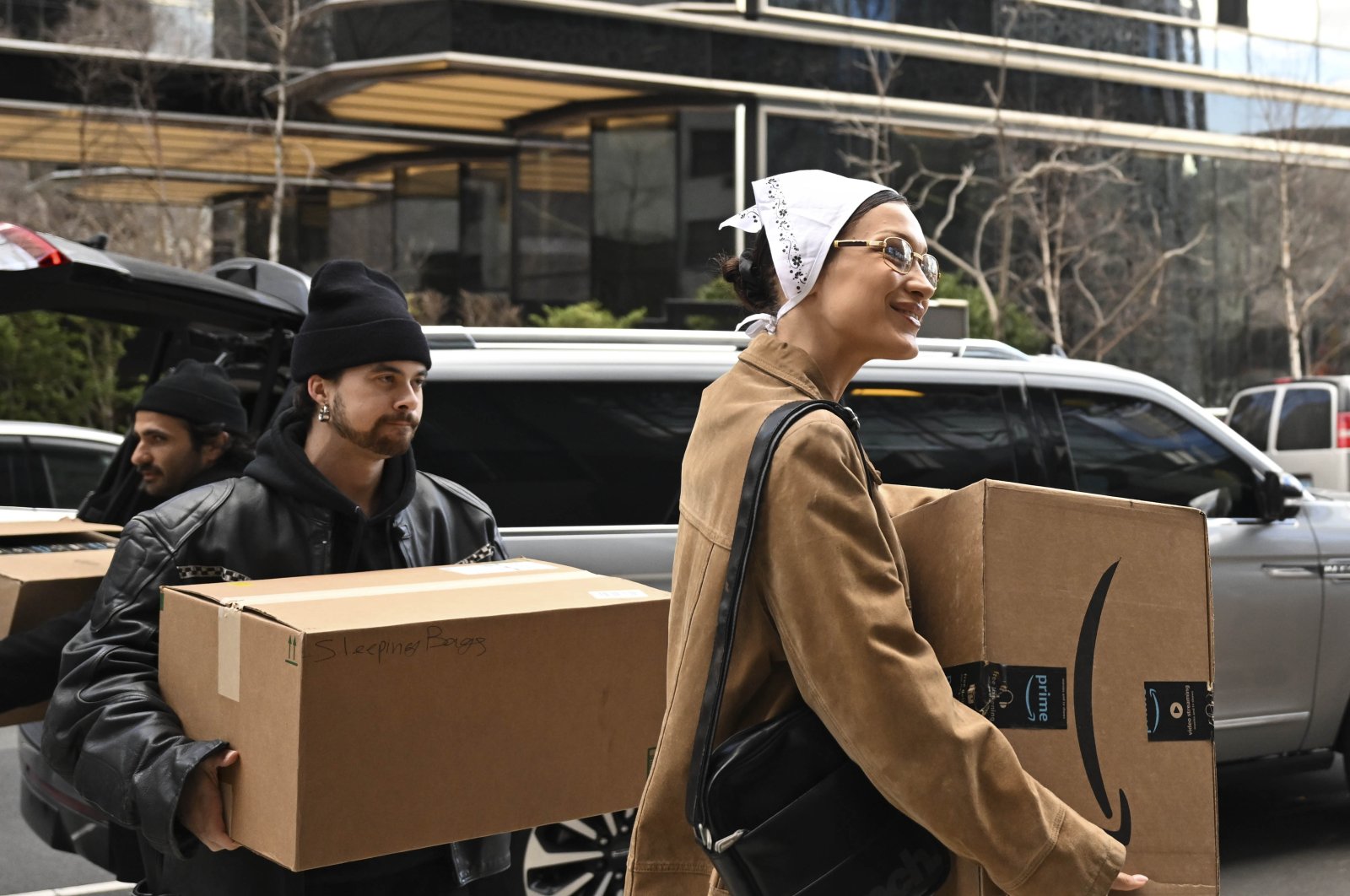 Supermodel Bella Hadid smiles as she carries a box filled with humanitarian aid supplies for Turkish earthquake survivors in New York, U.S., Feb. 24, 2023. (AA Photo)
