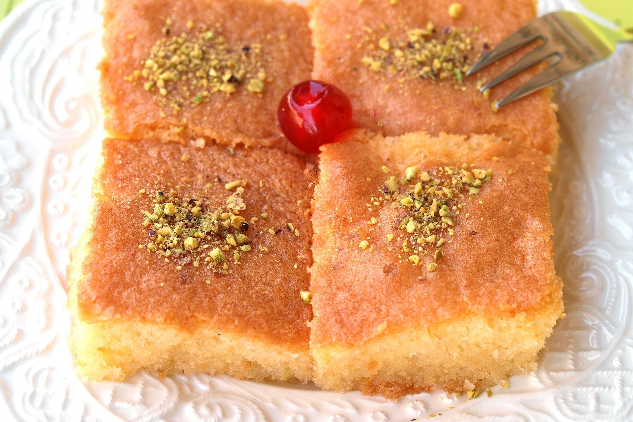 Four pieces of traditional Turkish sweet semolina cake called revani. (Shutterstock Photo)