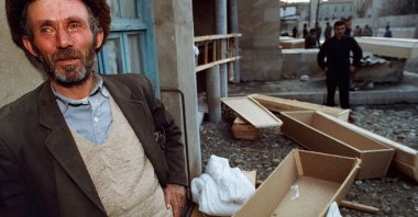 In this photo taken in February 1992, a man waits outside a morgue for the body of a dead relative, in Aghdam, Azerbaijan after the massacre. (Getty Images)