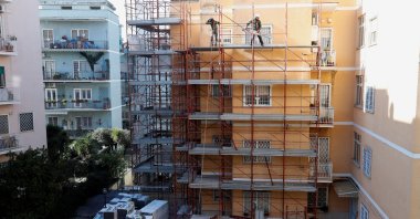 Builders work at the construction site of an energy-saving building, making apartments more energy-efficient under the government&#039;s &quot;superbonus&quot; incentives, in Rome, Italy, Feb. 1, 2023. (Reuters Photo)