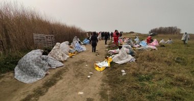 A group of people is assisted by emergency services at a beach near Cutro, Crotone province, southern Italy, Feb. 26, 2023. (EPA Photo)