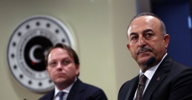 Mevlüt Çavuşoğlu (R) and European Commissioner for Neighborhood and Enlargement Oliver Varhelyi (L) give a joint news conference, in the capital Ankara, Türkiye, Feb. 22, 2023. (AFP Photo)
