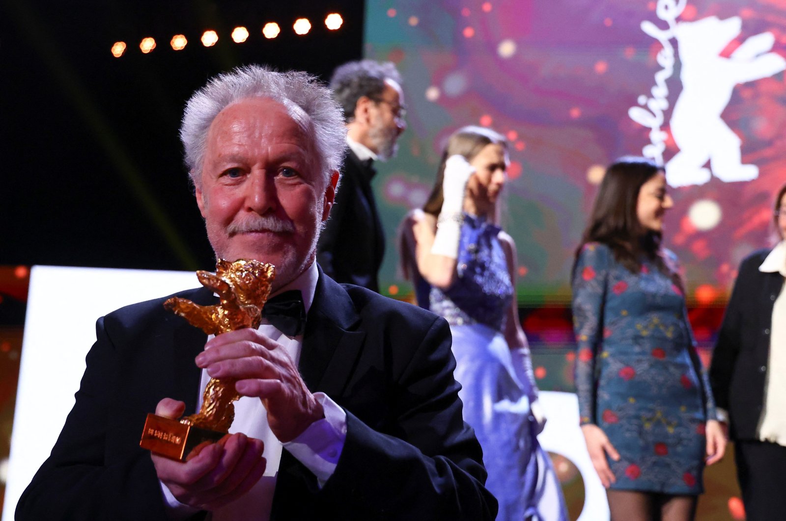 Director Nicolas Philibert poses with a Golden Bear for best film for &quot;On the Adamant&quot; at the awards ceremony at the 73rd Berlinale International Film Festival in Berlin, Germany, Feb. 25, 2023. (Reuters Photo)