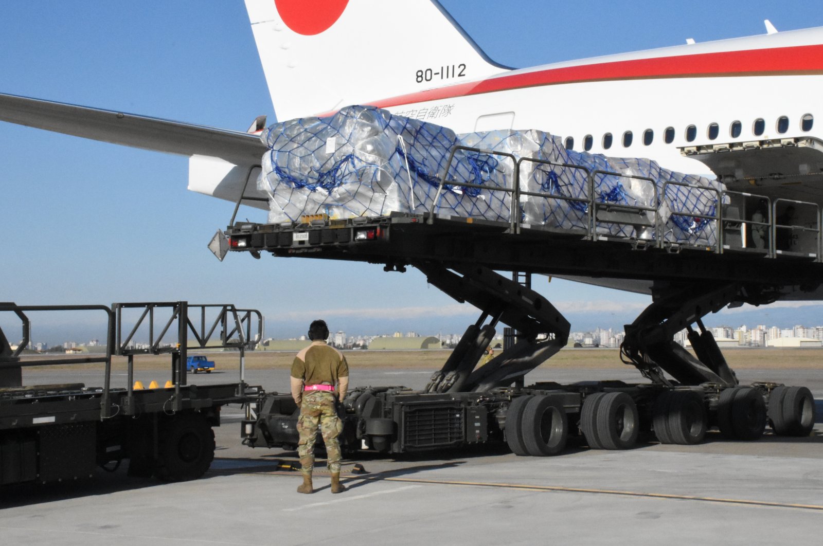 A cargo plane from Japan unloads aid supplies at an airport, in Adana, southern Türkiye, Feb. 21, 2023. (AA Photo)