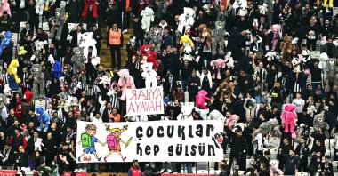 Beşiktaş fans hold toys in the stands during the Turkish Süper Lig football match between Beşiktaş and Antalyaspor at the Vodafone stadium, Istanbul, Türkiye, Feb. 26, 2023. (AA Photo)
