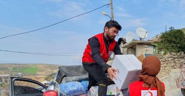 Students from Pakistan help distribute aid with the Turkish Red Crescent in Hatay, Türkiye, Feb. 26, 2023. (Photo by Sisa Bodani)