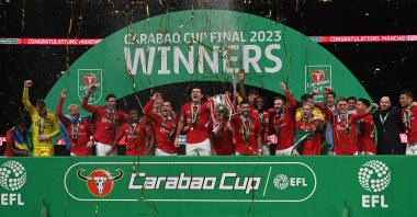 Manchester United&#039;s players celebrate with the trophy after their victory in the English League Cup final football match against Newcastle United at Wembley Stadium, London, U.K., Feb. 26, 2023. (AFP Photo)