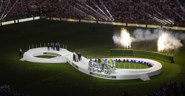 Argentina players celebrate with the winner's trophy after their win in the World Cup final soccer match against France at the Lusail Stadium in Lusail, Qatar, Dec. 18, 2022. (AP Photo)