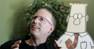 Scott Adams, creator of the comic strip Dilbert, talks about his work at his studio in Dublin, California, U.S., Oct. 26, 2006. (AP Photo)