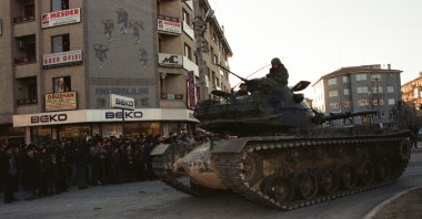 An armored tank rolls down a street toward the Akıncı Base in the Sincan district of the Turkish capital Ankara, on Feb. 4, 1997. (AA Photo)