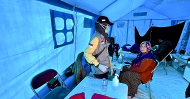 Indonesian doctor Dr. Zainab Aqila provides treatment inside a field hospital following the devastating earthquakes in Türkiye's southeastern province of Hatay, Feb. 27, 2023. (AA Photo)