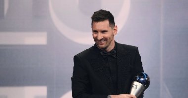 Argentina and Paris Saint-Germain forward Lionel Messi poses on stage after receiving the Best FIFA Men Player award during the Best FIFA Football Awards 2022 ceremony, Paris, France, Feb. 27, 2023. (AFP Photo)
