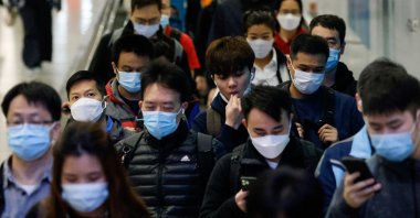 People wear face masks in the MTR station, a day before government scraps the mask rule in Hong Kong, China, Feb. 28, 2023. (Reuters Photo)