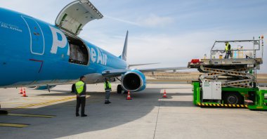 An Amazon Air cargo plane is being loaded with disaster relief supplies in an unspecified location. (Courtesy of Amazon)
