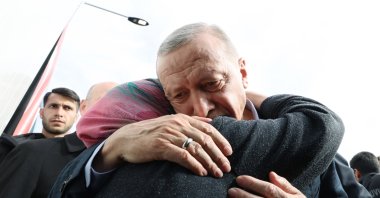 President Recep Tayyip Erdoğan hugs an earthquake survivor in Elbistan, Kahramanmaraş, southern Türkiye, Feb. 28, 2023. (AA Photo)