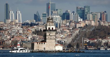 Maiden's Tower, an islet on the Bosporus, is pictured with skyscrapers in the background in Istanbul, Türkiye, Feb. 23, 2020. (Reuters Photo)