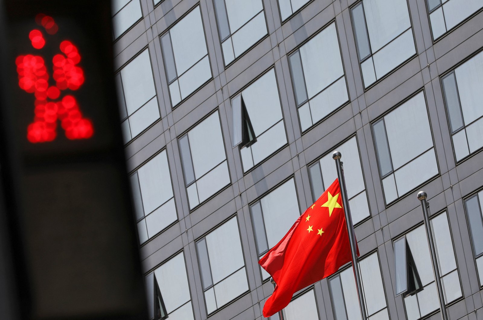 A Chinese national flag flutters outside the China Securities Regulatory Commission (CSRC) building on the Financial Street in Beijing, China, July 9, 2021. (Reuters Photo)