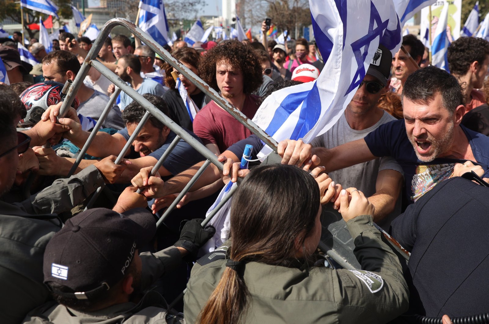 Police hold back demonstrators blocking the Ayalon Road in Tel Aviv, Israel, March 1, 2023. (EPA Photo)