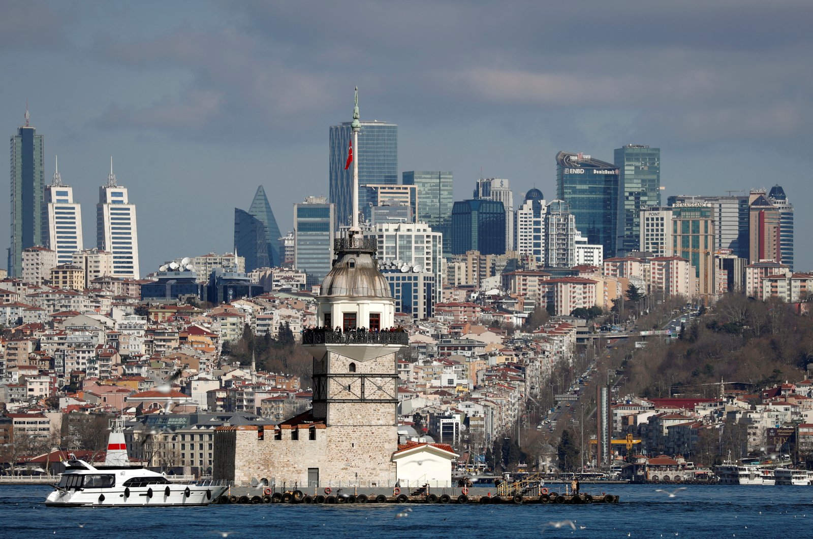Maiden&#039;s Tower, an islet on the Bosporus, is pictured with skyscrapers in the background in Istanbul, Türkiye, Feb. 23, 2020. (Reuters Photo)