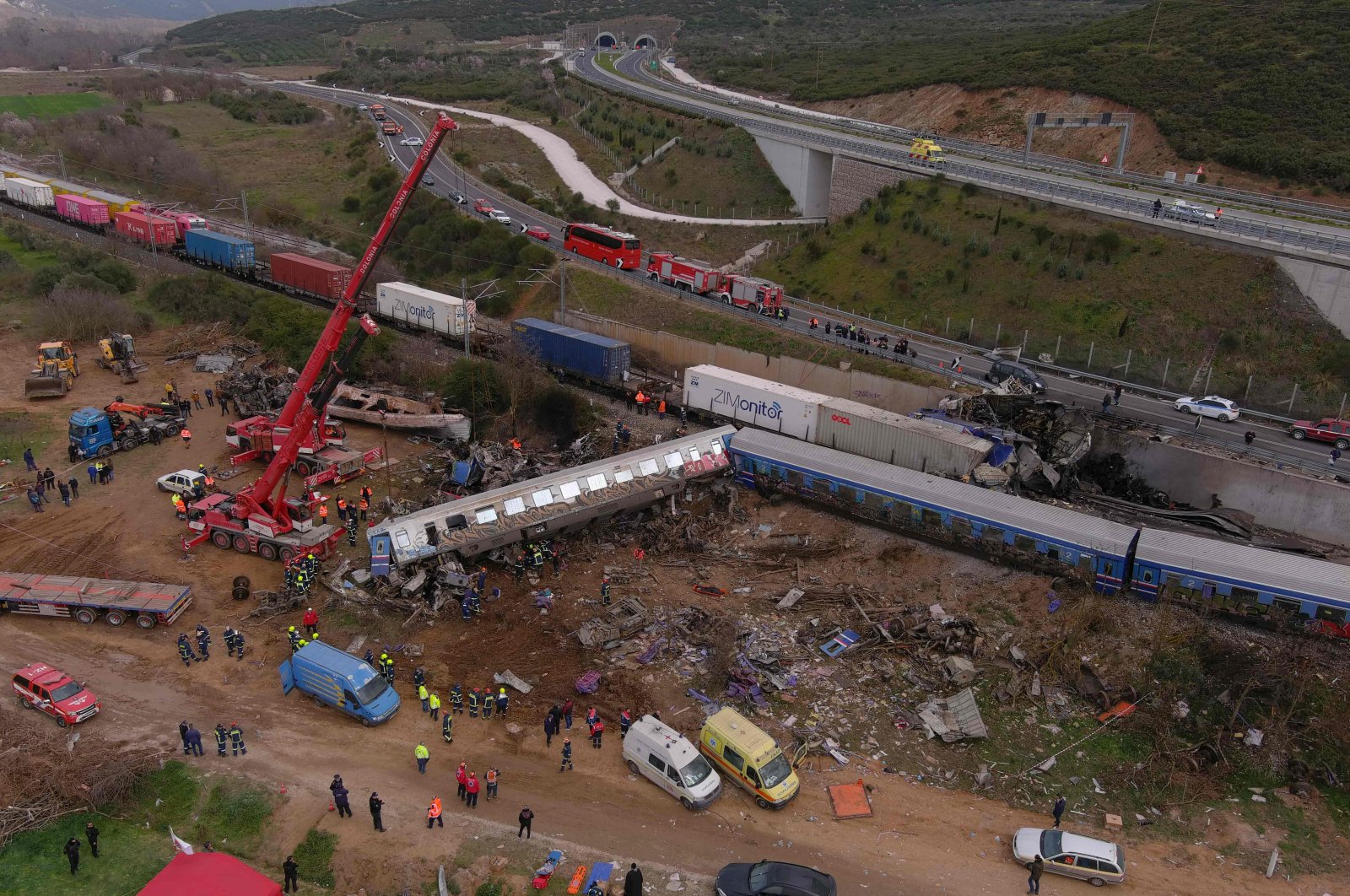 An aerial drone photograph shows emergency crews examining the wreckage after a train accident in the Tempi Valley near Larissa, Greece, March 1, 2023. (AFP Photo)