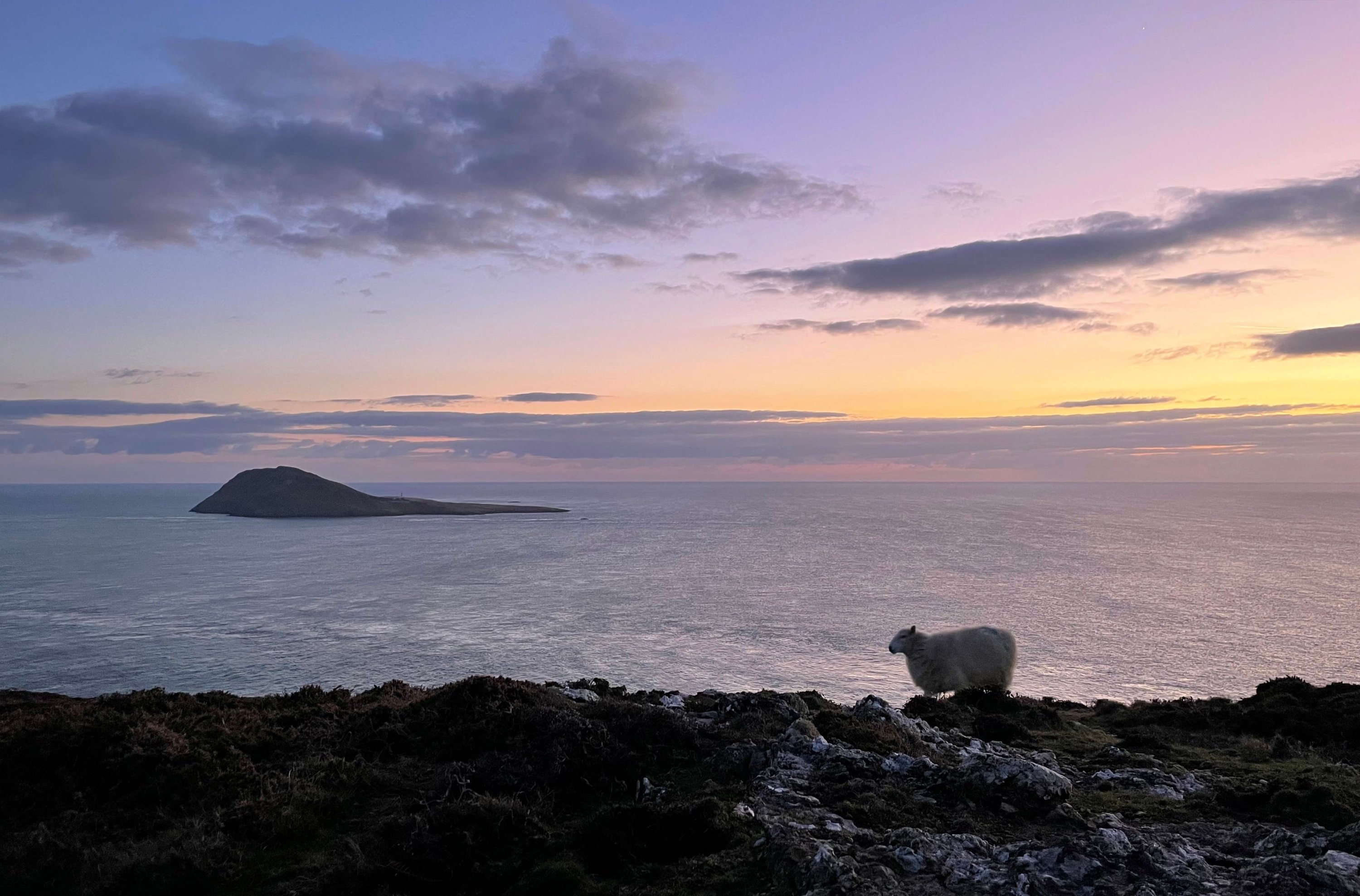The island of Ynys Enlli, known as Bardsey Island in English, is pictured of the west coast of Wales, south west of Pwllheli, Feb. 26, 2023. (AFP Photo)