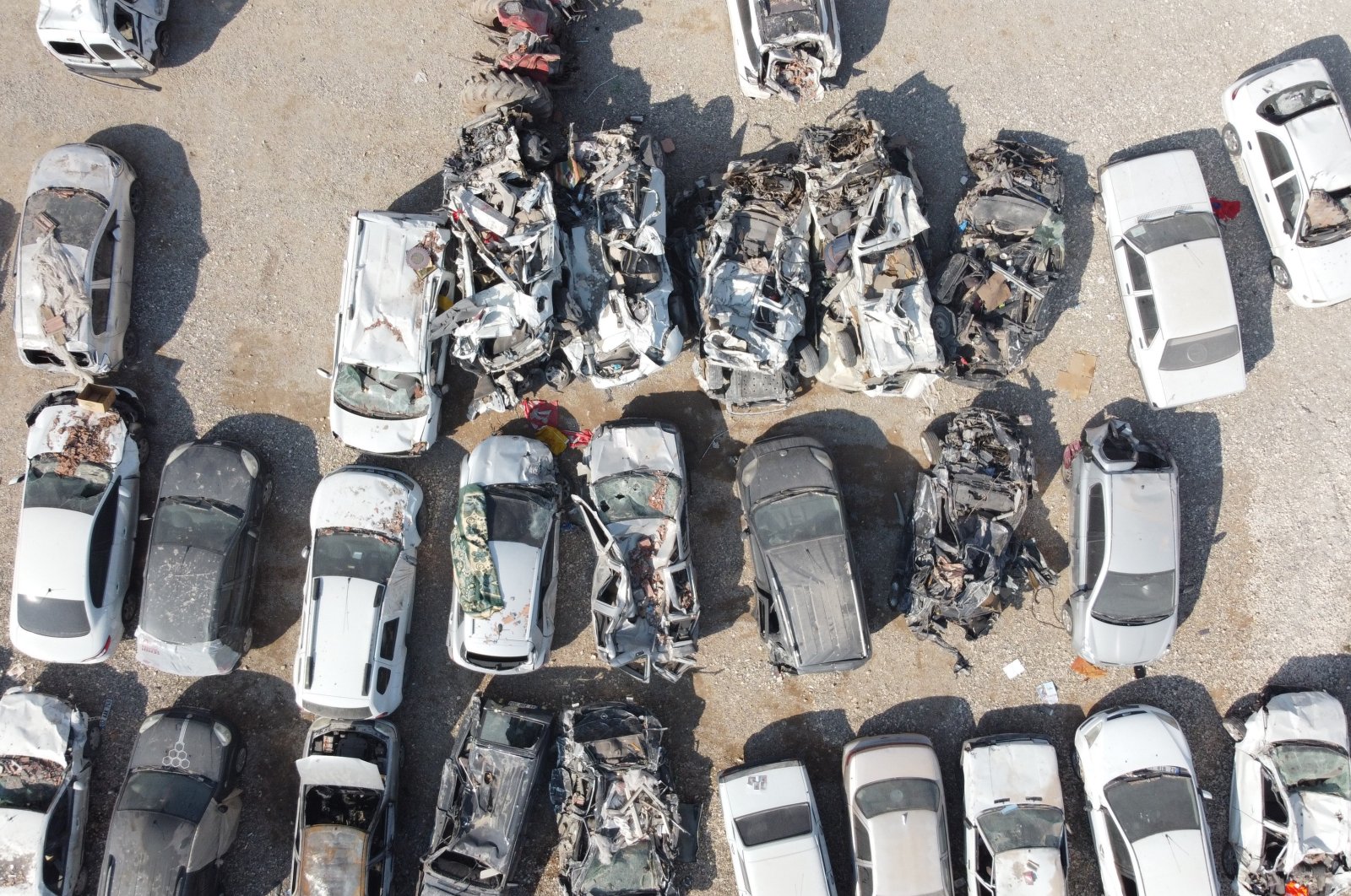 An aerial view of a parking lot where cars damaged in the earthquakes are being stored, Adıyaman, southeastern Türkiye, Feb. 27, 2023. (IHA Photo)