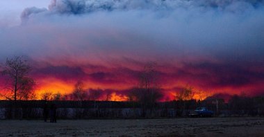 A wildfire moves towards the town of Anzac from Fort McMurray, Alberta, Canada, May 4, 2016. (AP Photo)