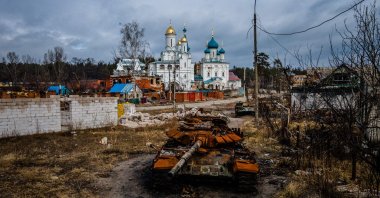 A destroyed Russian T-72 tank is photographed near Pokrovy Presvyatoyi Bohorodytsi Church, in the city of Svyatohirs'k, Donetsk region, Ukraine, March 1, 2023. (AFP Photo)
