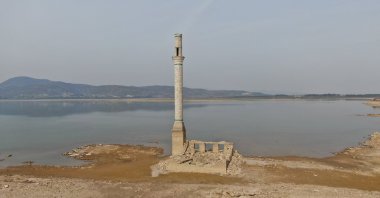 With the decrease in the water level in Tahtalı Dam, the mosque in the old settlement can be seen clearly, Izmir, Türkiye, March 2, 2023. (IHA Photo)