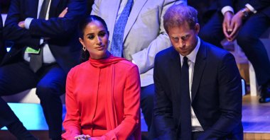 Britain's Meghan, Duchess of Sussex and Britain's Prince Harry, Duke of Sussex, react as they attend a summit in Manchester, U.K., Sept. 5, 2022. (AFP Photo)