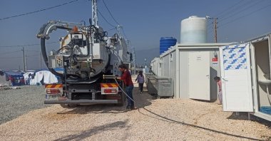 A water truck delivers water for showers and toilets in a container city housing citizens displaced by the earthquakes in southern Hatay province, Türkiye, March 3, 2023. (AA Photo)