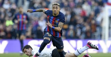 Barcelona's Raphinha goes past Valencia's Jesus Vazquez in a La Liga match, Barcelona, Spain, March, 5, 2023. (AA Photo)