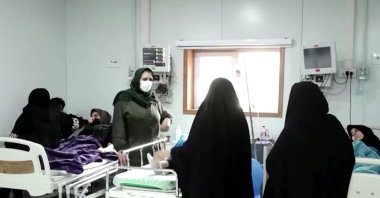 This screengrab shows concerned parents visiting their children at the school in Tehran, Iran, March 4, 2023. (Reuters Photo)  