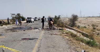 Security officials examine the site of a suicide attack Dhadar, Balochistan, Pakistan, March 6, 2023. (AFP Photo)