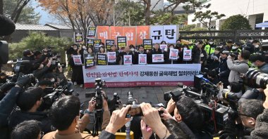 Members of civic groups hold a rally against South Korea's announcement of a plan to compensate victims of Japan's forced wartime labour, outside the Foreign Ministry in Seoul, South Korea, Monday, March 6, 2023. 