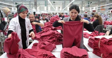 Women employed at a textile factory in the organized industrial zone in Kırıklareli produce clothes for earthquake victims, Kırıklareli, Türkiye, Feb. 18, 2023. (AA Photo)