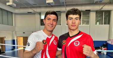 Kickboxers Mikail Çevik (L) and Hüseyin Tarık Kalalı pose after training for Istanbul's International Kick Boxing World Cup, Osmaniye, Türkiye, March 6, 2023. (AA Photo)