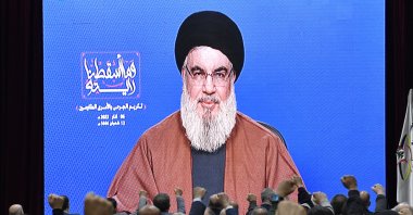 Supporters of Hezbollah listen to a speech by Hezbollah leader Sayyed Hassan Nasrallah delivered on a big screen during a rally to commemorate Hezbollah Wounded Resistance Day, Beirut, Lebanon, March 6, 2023. (EPA Photo)