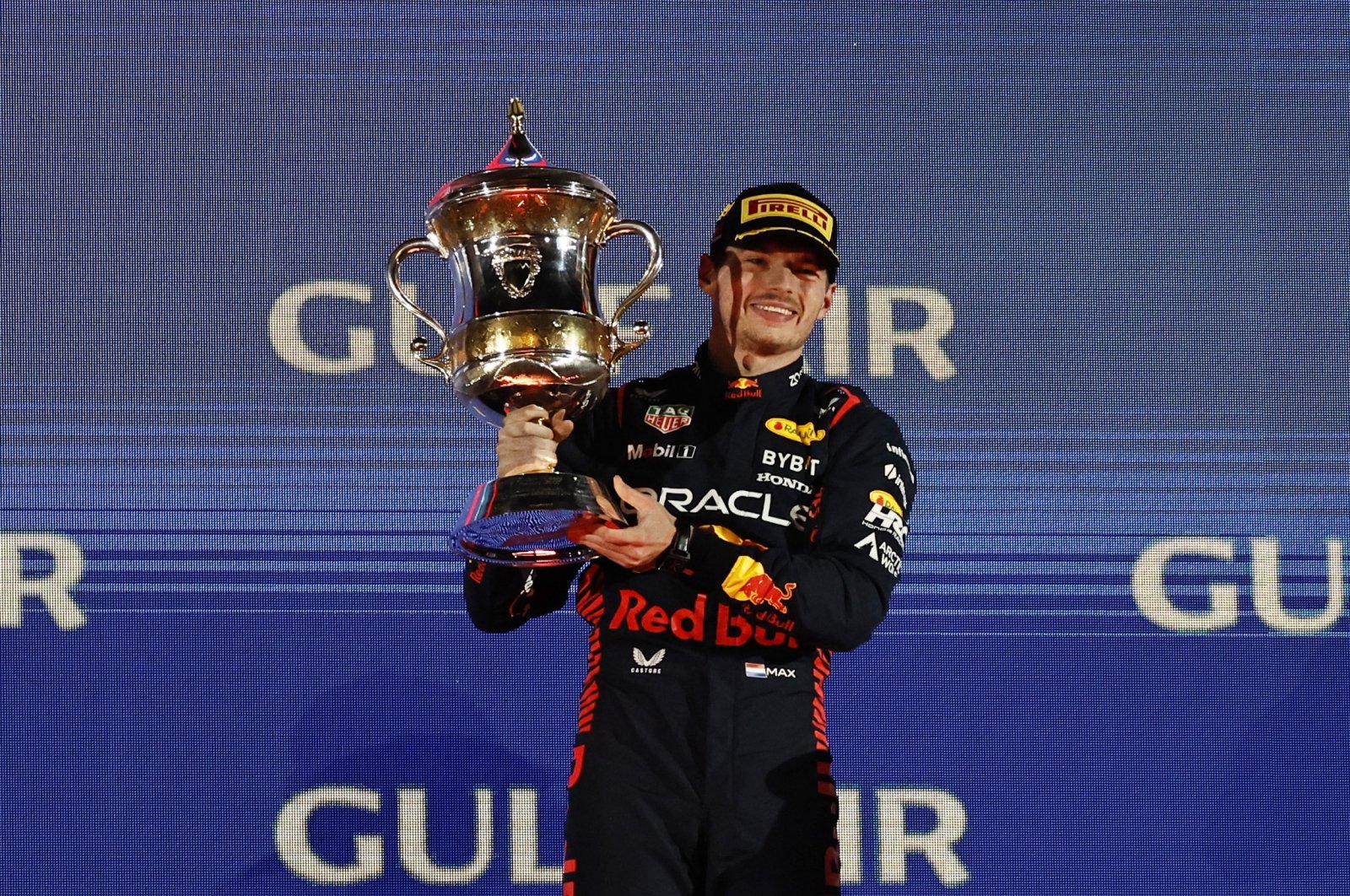 Red Bull&#039;s Max Verstappen celebrates on the podium with a trophy after winning the Bahrain Grand Prix Formula One at the Bahrain International Circuit, Sakhir, Bahrain, March 5, 2023. (Reuters Photo)