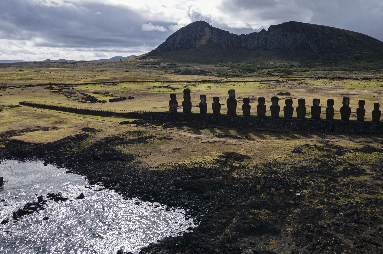 Moai statues stand on Ahu Tongariki near the Rano Raraku volcano, on Rapa Nui, or Easter Island, Chile, Nov. 27, 2022. (AP Photo)