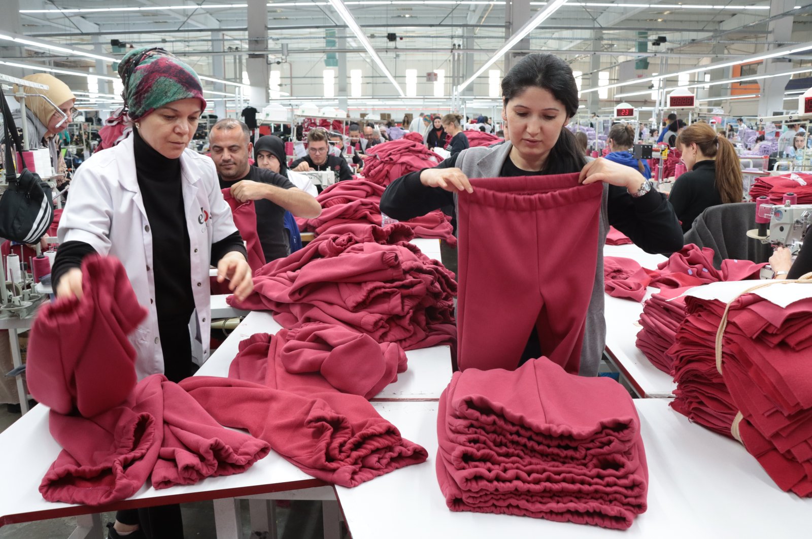 Women employed at a textile factory in the organized industrial zone in Kırıklareli produce clothes for earthquake victims, Kırıklareli, Türkiye, Feb. 18, 2023. (AA Photo)