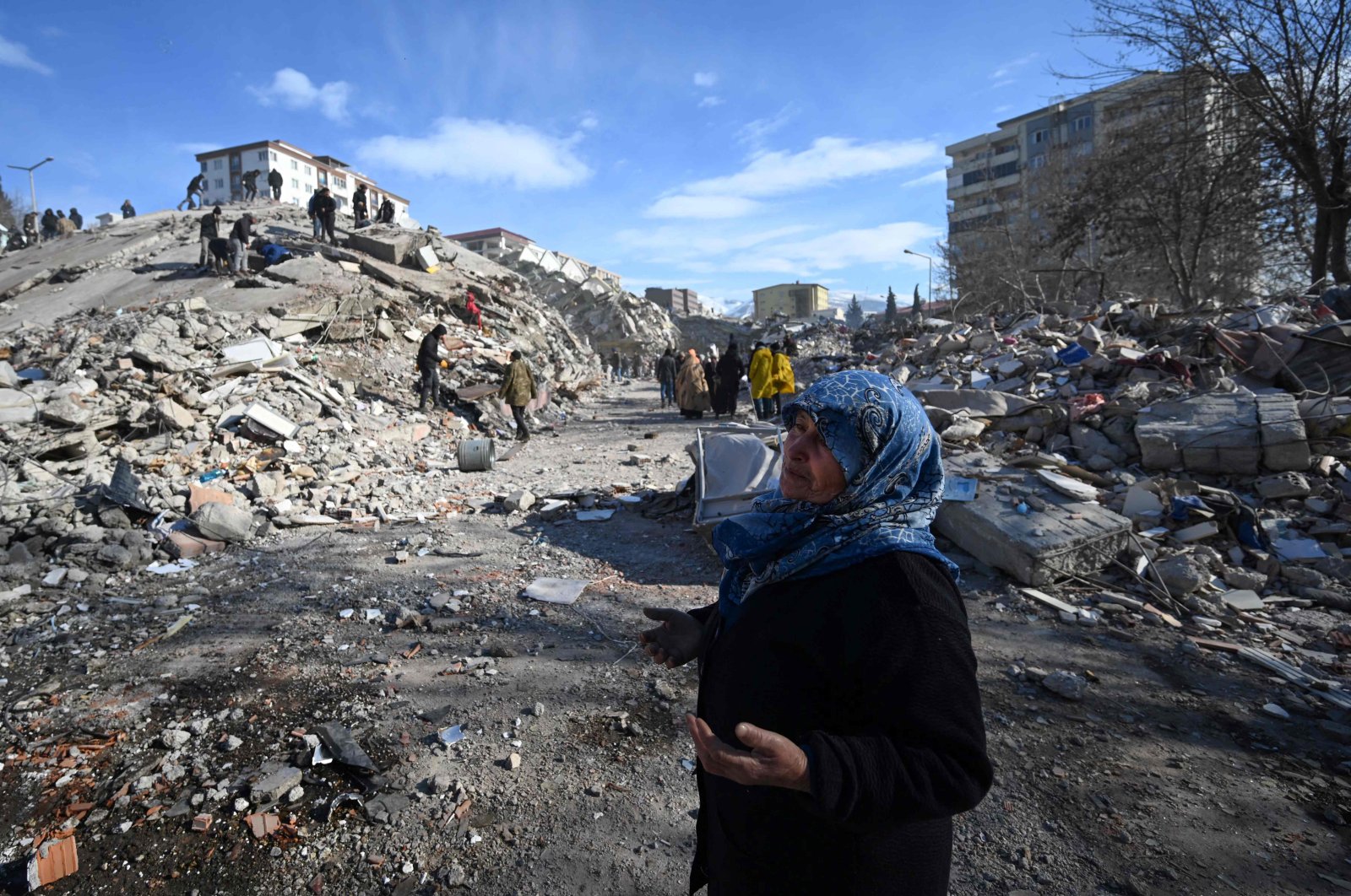 A woman reacts as she stand among the rubble of collapsed buildings in the southeastern city of Kahramanmaraş, Türkiye, Feb. 8, 2023. (AFP Photo)